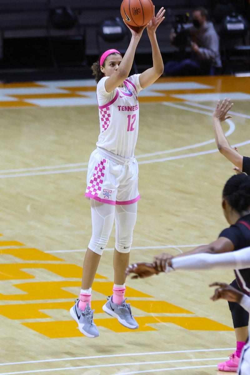 Feb 18, 2021; Knoxville, Tennessee, USA; Tennessee Lady Vols guard Rae Burrell (12) shoots a three pointer against the South Carolina Gamecocks during the second half at Thompson-Boling Arena. Mandatory Credit: Randy Sartin-USA TODAY Sports