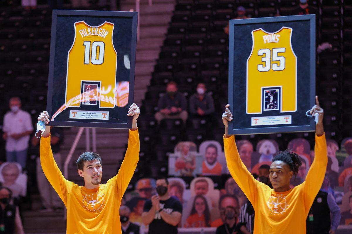 Mar 7, 2021; Knoxville, Tennessee, USA; Tennessee Volunteers forward John Fulkerson (10) and guard Yves Pons (35) are recognized on senior day before the game against the Florida Gators at Thompson-Boling Arena. Mandatory Credit: Randy Sartin-USA TODAY Sports