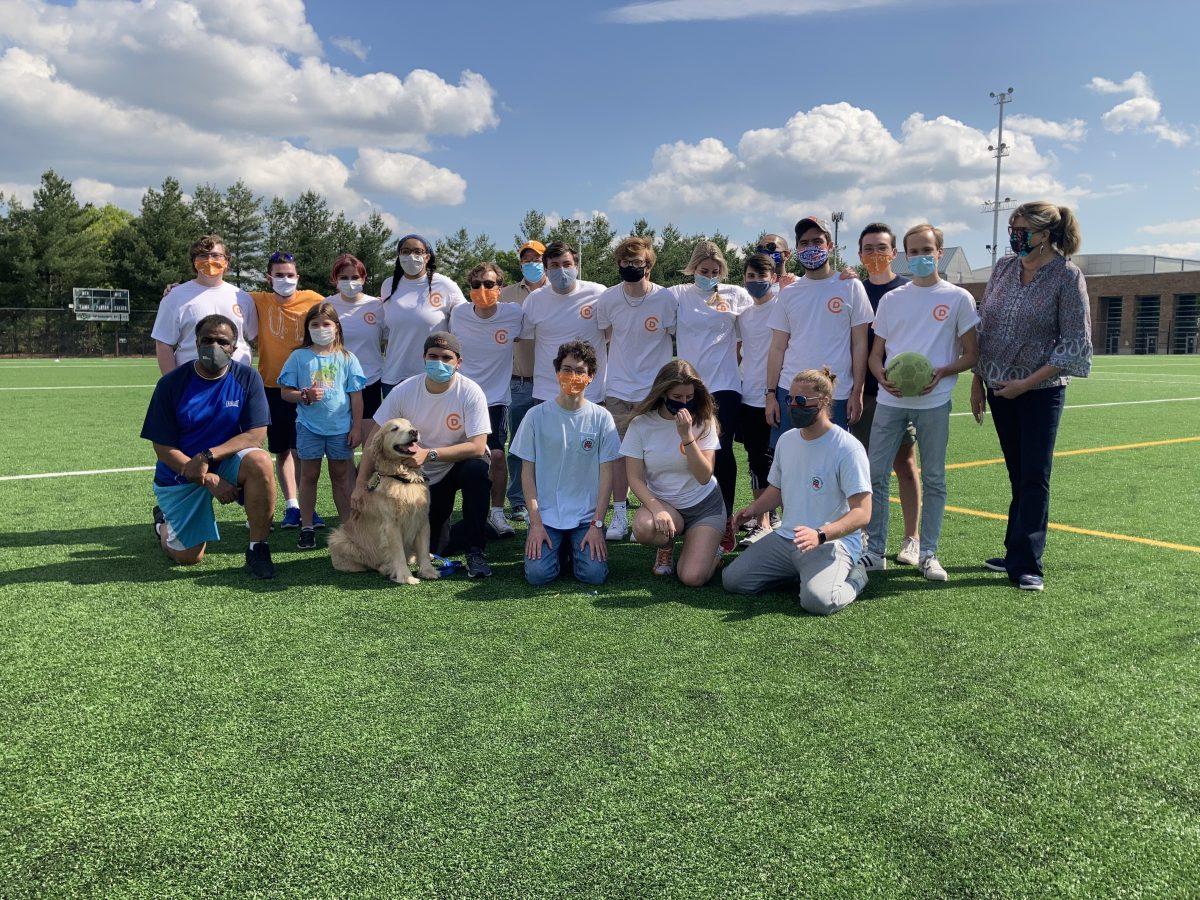 Students from College Democrats and College Republicans pose with state representatives Sam McKenzie (lower left) and Gloria Johnson (upper right) after a bipartisan kickball game on April 25, 2021.