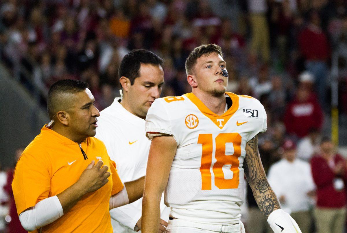 Tennessee's quarterback Brian Maurer, #18, is helped off the field during the Tennessee and Alabama football game at Bryant-Denny Stadium on Saturday, Oct.19, 2019.