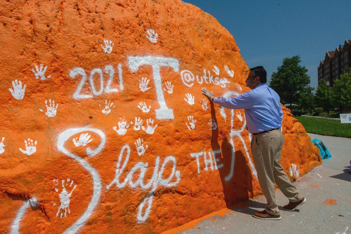Frank Cuevas, Vice Chancellor of Student Life, leaving his mark on The Rock during the Seventh Annual Slap the Rock event hosted by the Student Government Association on Aug 26, 2021. "Our students, faculty, and staff are so excited to get together in a way that celebrates the University of Tennessee," said Dr. Cuevas. "Brings a whole new energy level that was missing on campus last year".