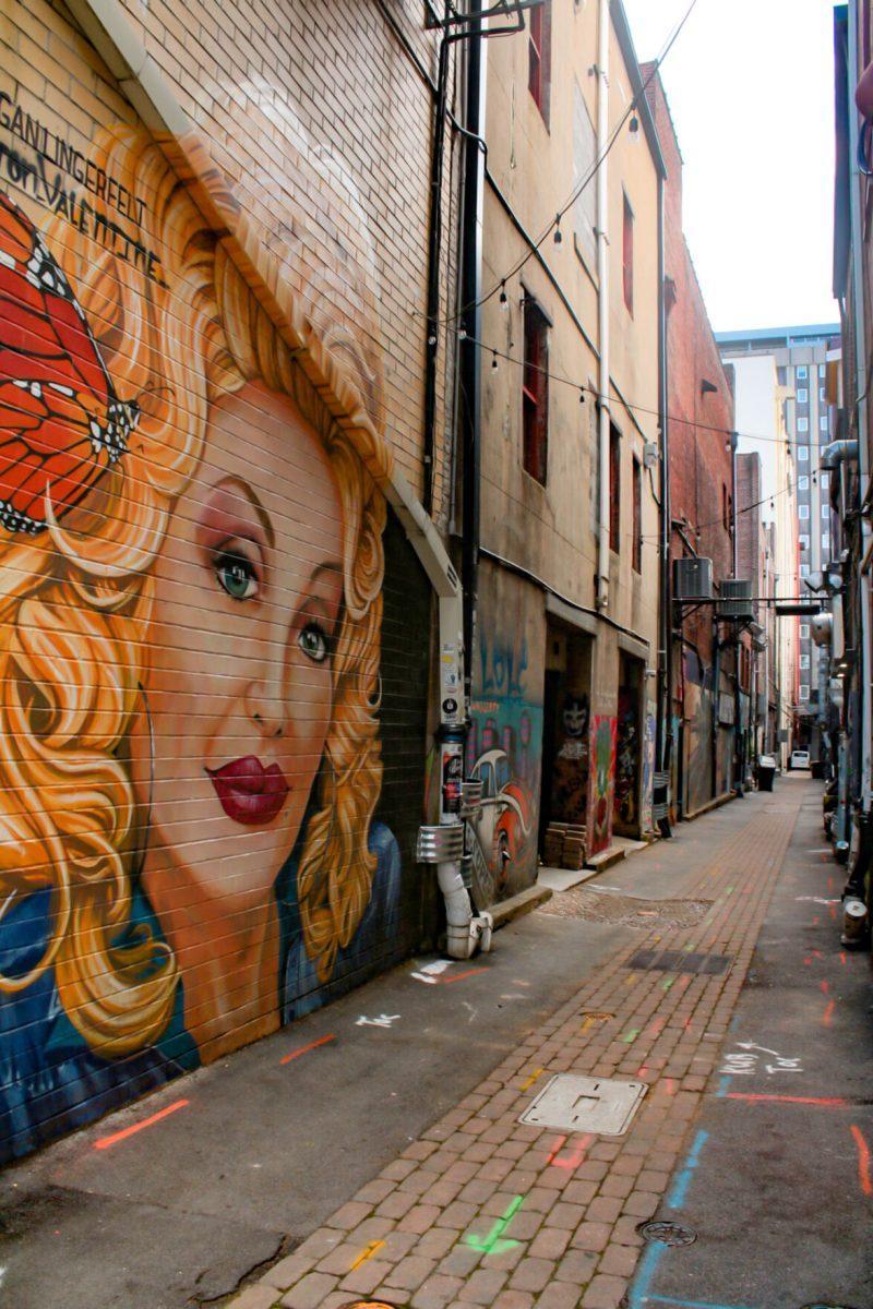 Grafitti art of Dolly Parton located in Market Square, downtown Knoxville on Apr 30, 2021.