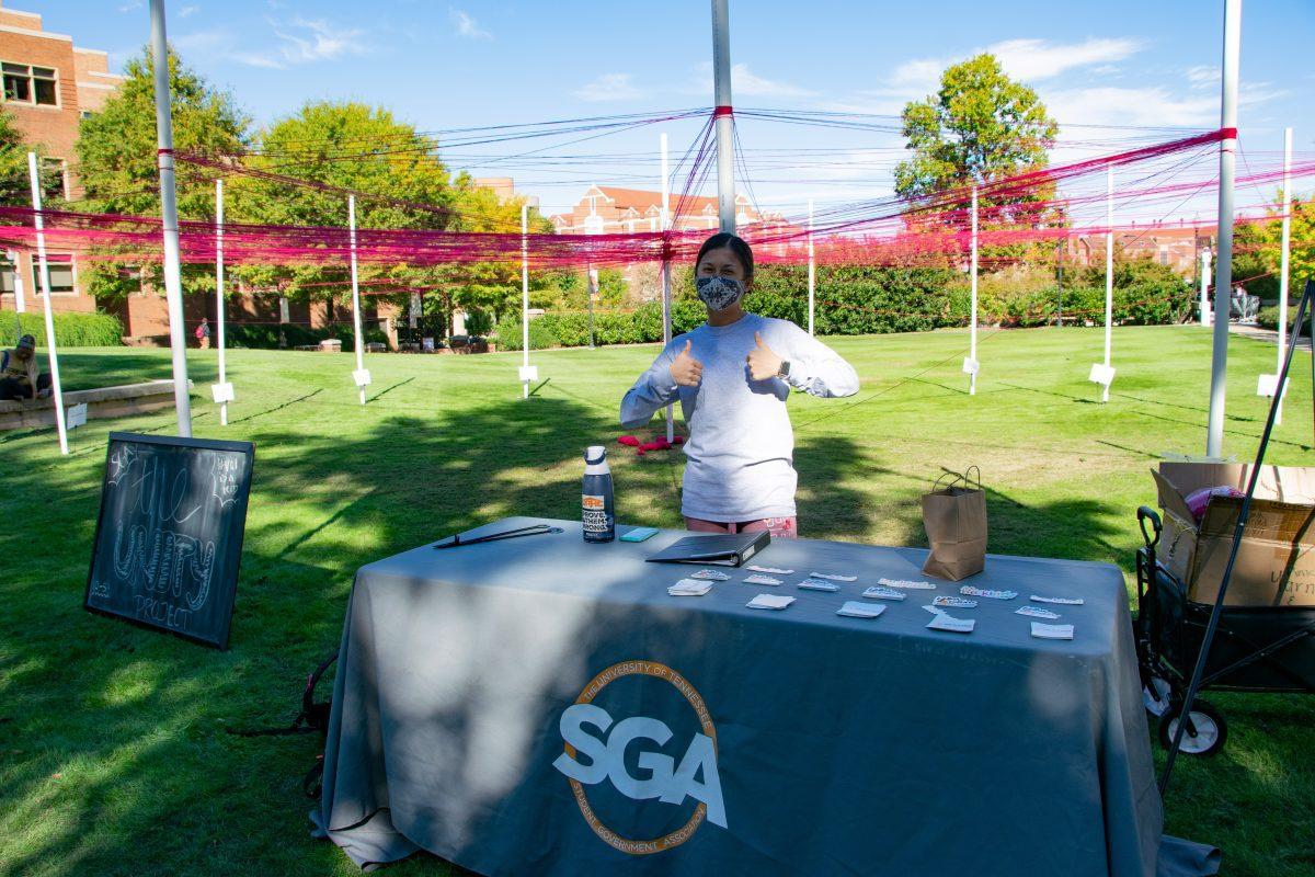 Jennifer Ross, sophomore, working the SGA table at their Unity Project event in HSS Plaza on Wednesday, Oct 27, 2021.