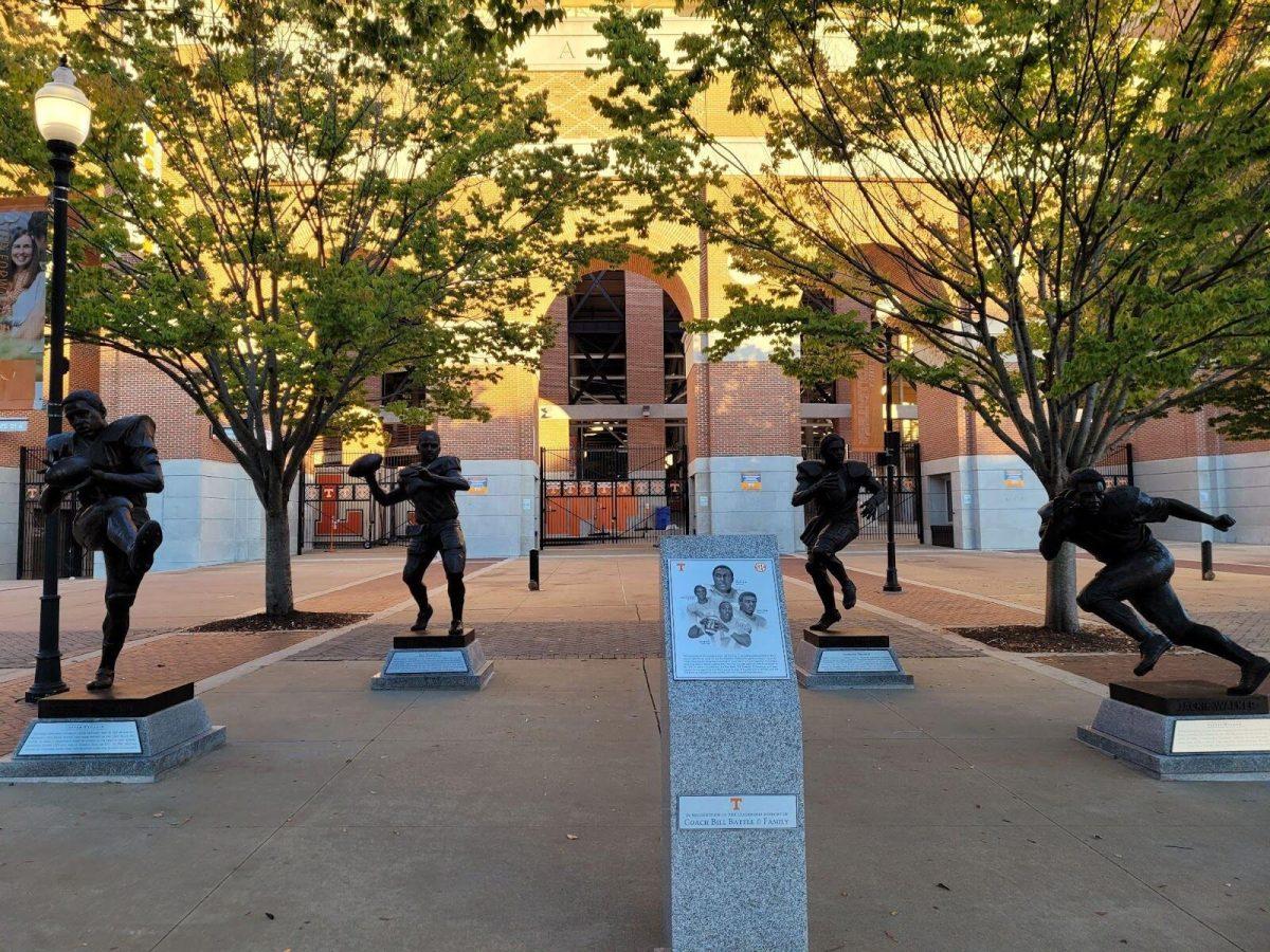 New sculptures by Neyland Stadium depict famous football players in UT's history.
 