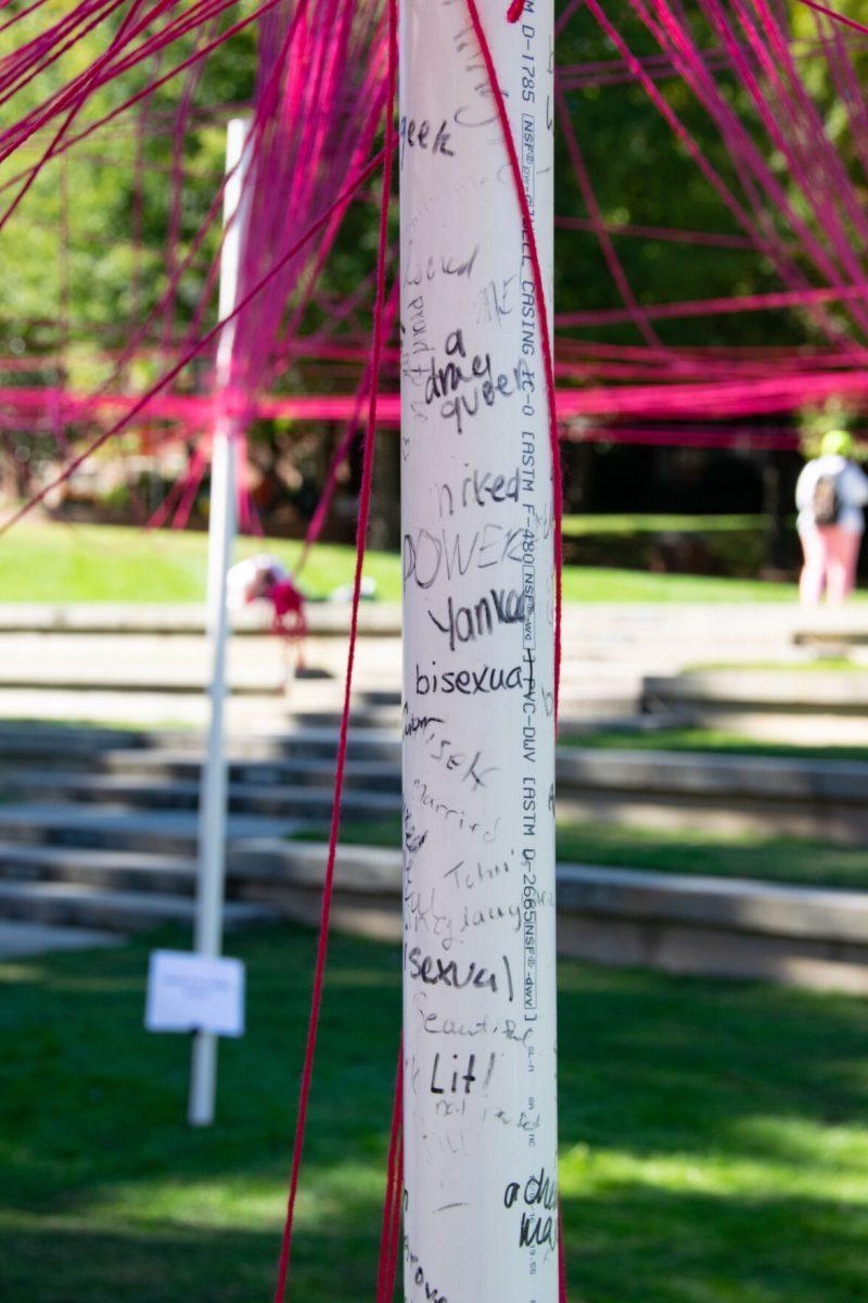 Names, words, and phrases that students identify with written on the center post at The Unity Project in HSS Plaza on Wednesday, Oct 27, 2021.