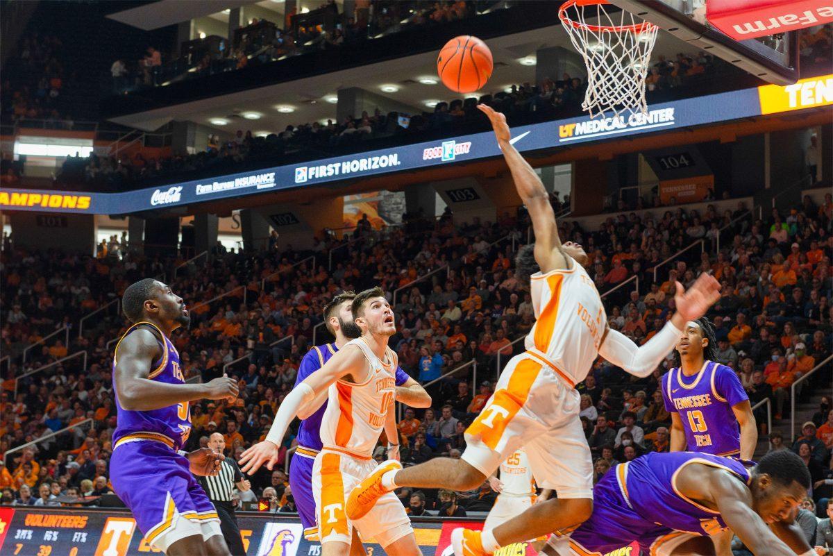Kennedy Chandler (1) goes to the rim as Tennessee Tech's Amadou Sylla (12) attempts to block him in Thompson Boling Arena on Nov. 26, 2021.