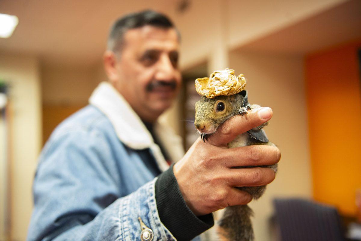 Sinan the Squirrel, the smallest Vol fan and a staple of Neyland tailgates, pictured with his owner, Saed Awad. 