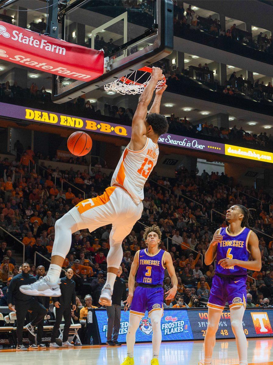 Olivier Nkamhoua (13) dunks the ball against Tennessee Tech at Thompson Boling Arena on Nov. 26, 2021. 