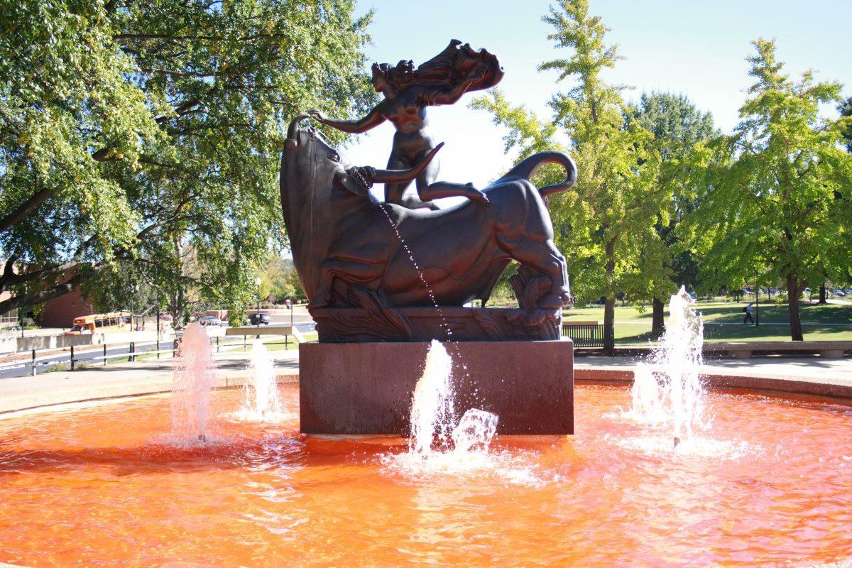 The Europa and the Bull statue located in McClung Plaza is dyed orange in preparation for Homecoming week. 