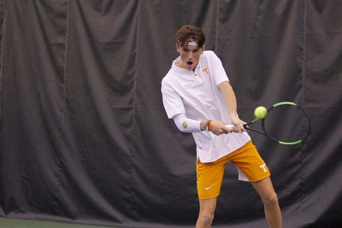 Pat Harper returns a serve during the Men's Tennis opening game against New Mexico, in the Goodfriend Tennis Center on January 18, 2020.