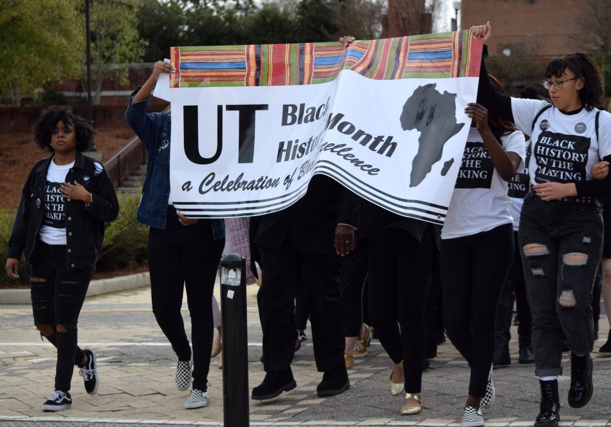 Members of the UT community march silently across UT's campus on Tuesday, Feb. 24, 2020 during the third annual Silent March. The silence allowed members of the march to reflect on why Black History Month is important to them.
