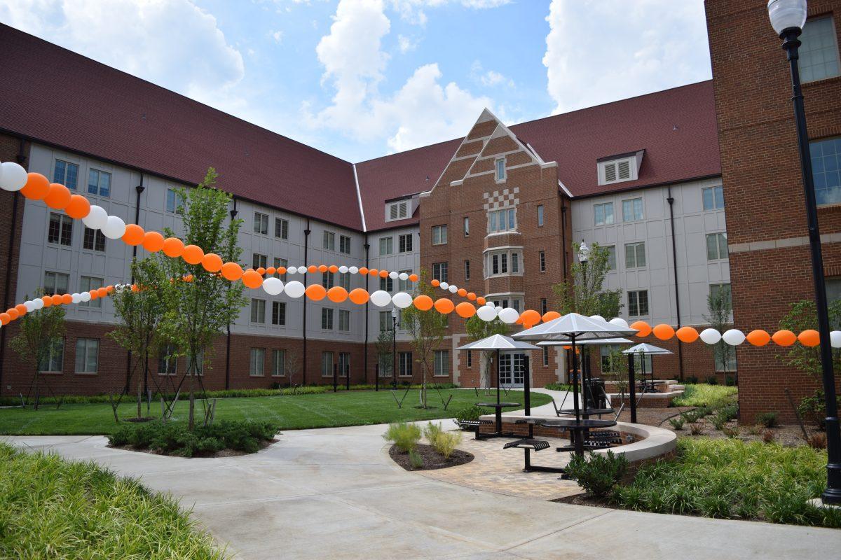 A courtyard in front of Dogwood residence hall was decorated with orange and white balloons during the ribbon cutting ceremony for Magnolia and Dogwood halls on Friday, Aug. 23, 2019.