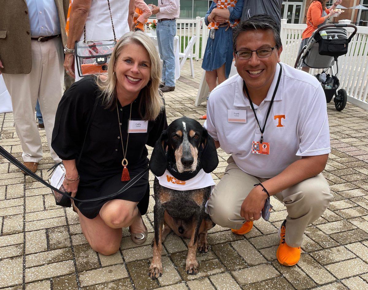 Cathy and Frank Cuevas, senior lecturer of communications studies and vice chancellor for student life, pictured with Smokey.