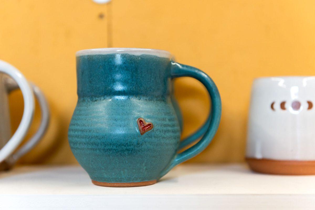A mug by local clay artist Stacy Shepanek in her studio at Mighty Mud in Knoxville, TN. Tuesday, Mar 8, 2022.