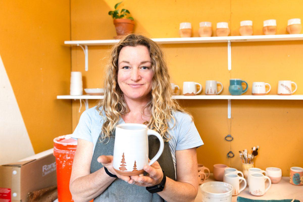 Local clay artist Stacy Shepanek holding a finished piece in her studio at Mighty Mud in Knoxville, TN. Tuesday, Mar 8, 2022.