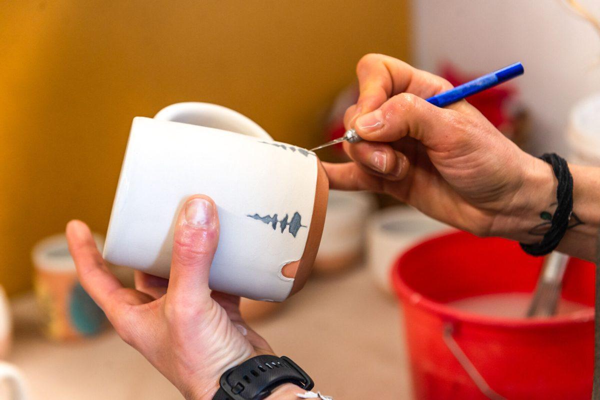 Local clay artist Stacy Shepanek working on a piece in her studio at Mighty Mud in Knoxville, TN. Tuesday, Mar 8, 2022.