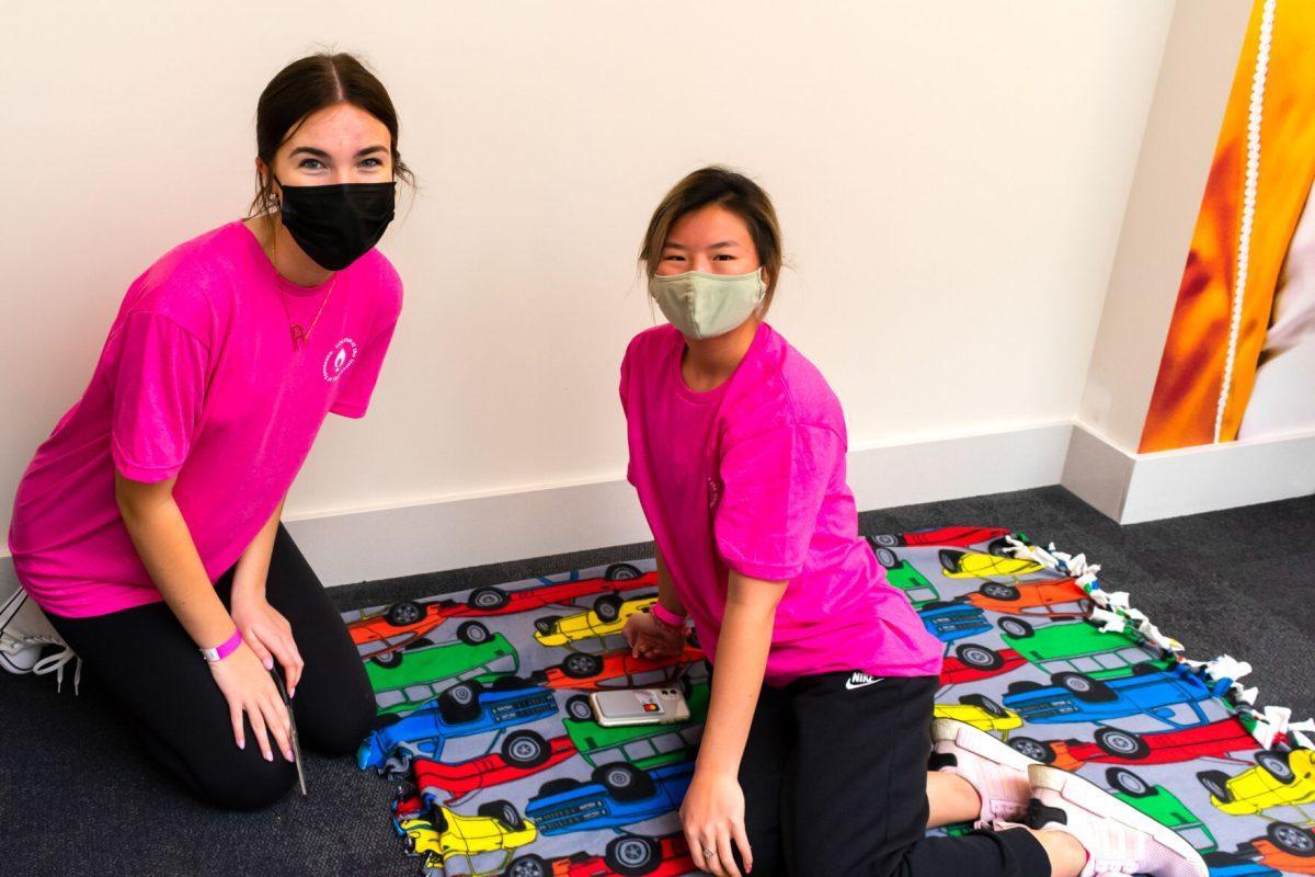 Students Raina Goodwin (left) and Erin George make blankets at the 2022 Volthon event held in the Student Union. Saturday, Feb. 26, 2022. 