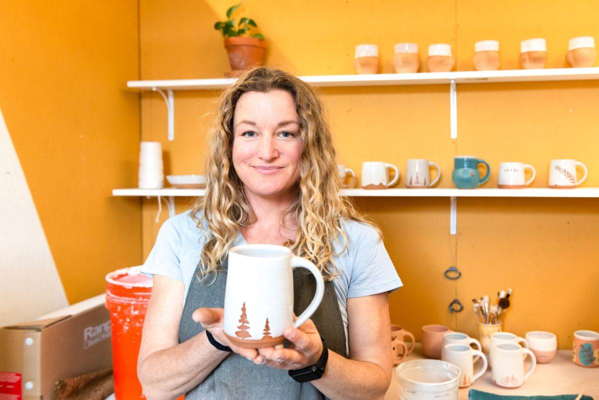Local clay artist Stacy Shepanek holding a finished piece in her studio at Mighty Mud in Knoxville, TN. Tuesday, Mar 8, 2022.
