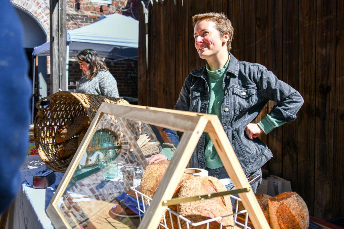 Meade Armstrong, owner of Mother's Daughter Bread, sells her baked goods to patrons of the Sunday Social Market hosted by Honeymouth. Sunday, Mar. 27, 2022.