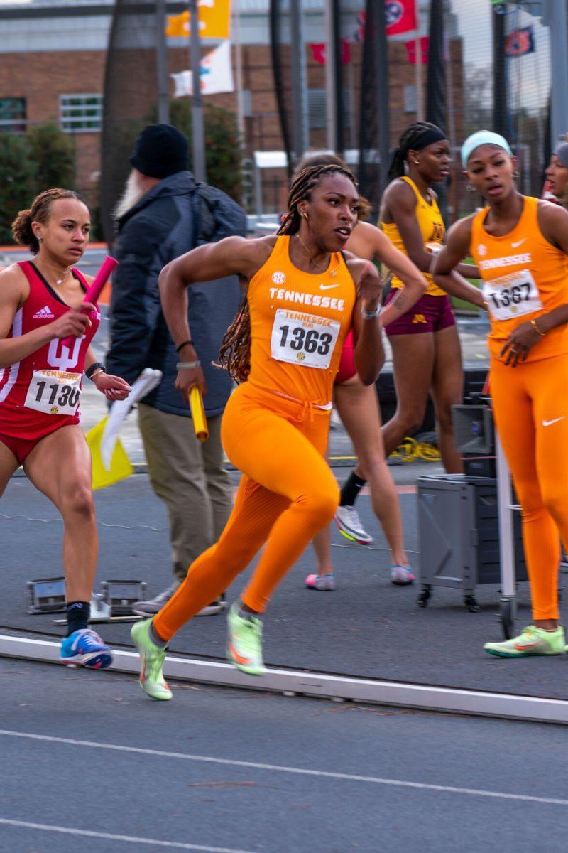 Tennessee's Uchech Nwogwugwu takes off during the women's 4x400 meter relay at Tom Black Track. Saturday Apr. 9, 2022.
