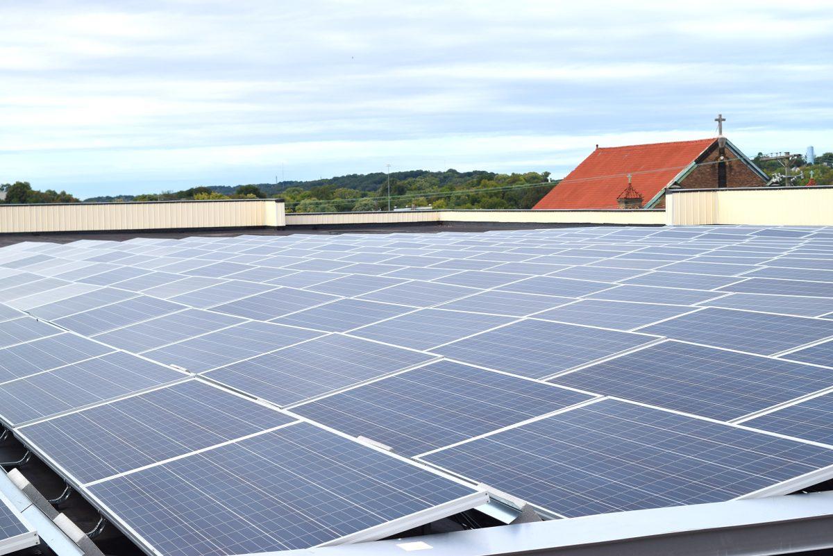 Rows of solar panels line the roof of the Knox Central Building as the first of 14 citywide solar panel installations.