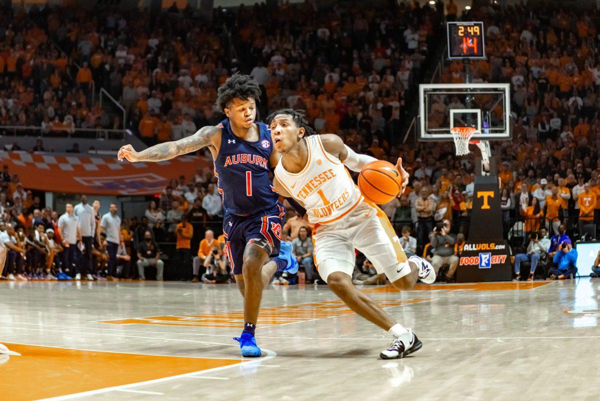 Kennedy Chandler, No.1, driving offense against Auburn in Thompson Boling Arena, Saturday Feb. 26, 2022.