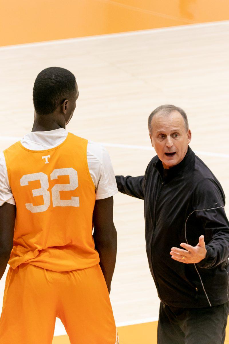 Head coach Rick Barnes with Handje Tamba (32) on the Pratt Pavilion court as the men's team practices for the upcoming season. Tuesday Oct. 26, 2021.