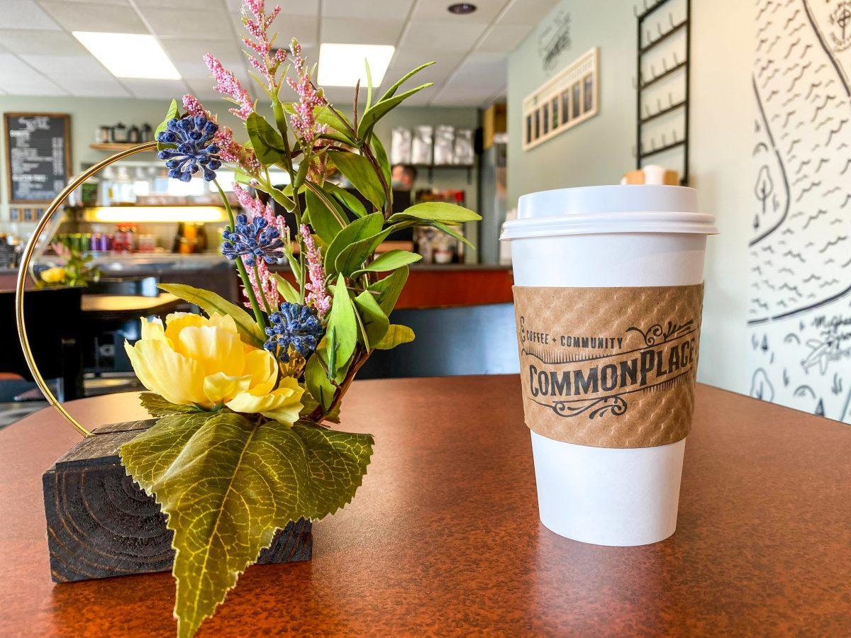 A to-go drink at CommonPlace Coffee features the company's specialty sleeves and logo, on Wednesday Apr 6, 2022.