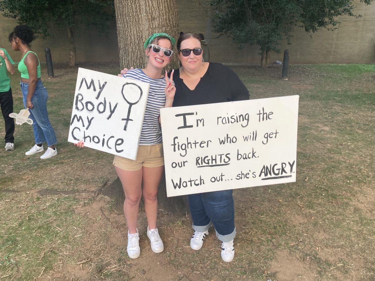 Jessica Hall (right) attended the protest on Friday with her daughter Sophia. "I just don’t want my daughter growing up in a world where men are regulating her body, her choices," she said. "It’s so dystopian, it’s frightening.”
