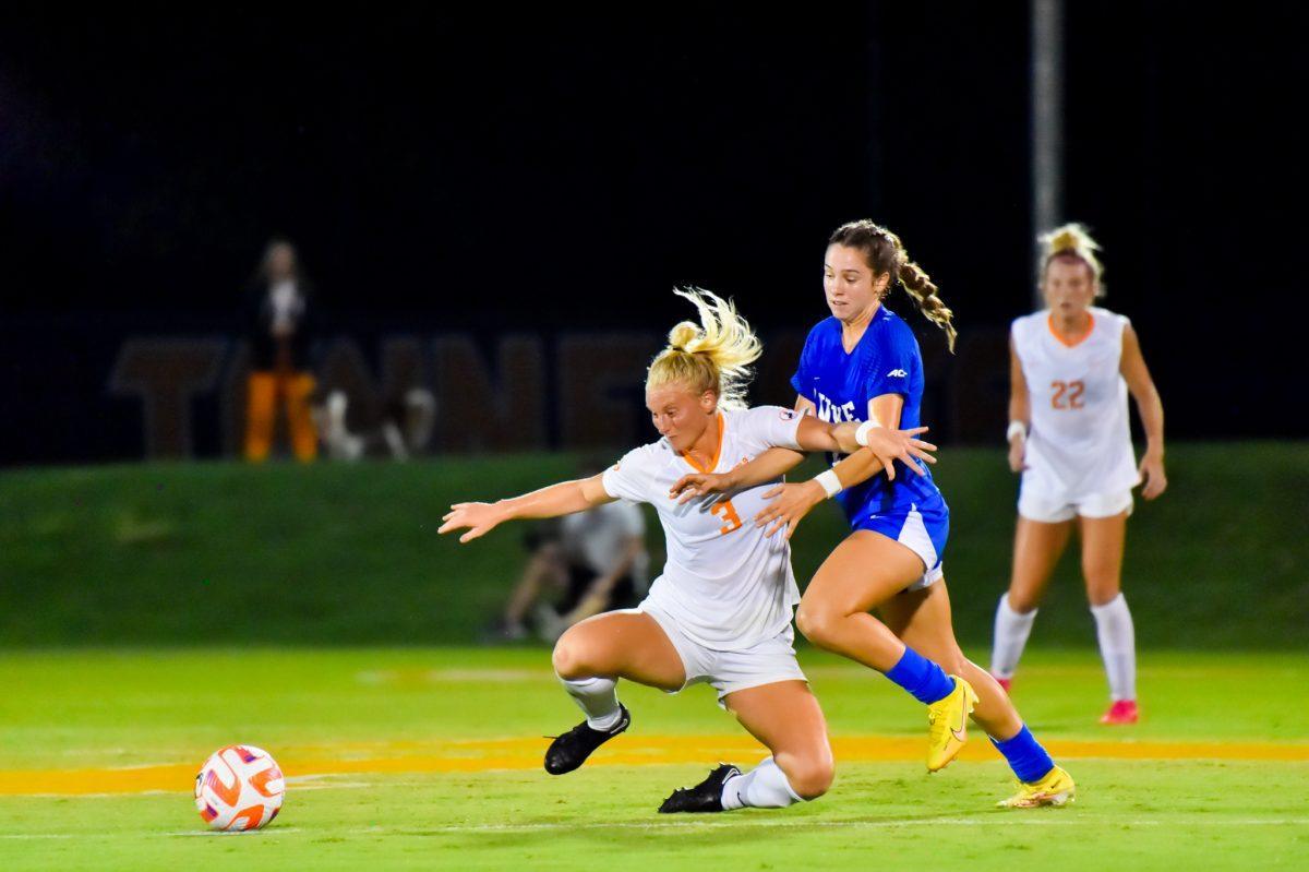 Defender Abbey Burdette fights off a Duke forward in Tennessee's game against Duke on August 25, 2022 at Regal Soccer Stadium.