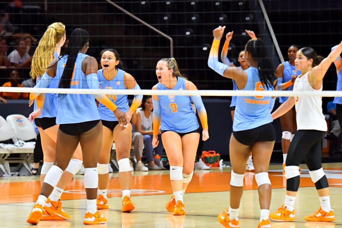 Lady Vols celebrate a point made against Purdue in Thompson Boling Arena on Aug. 27, 2022.
