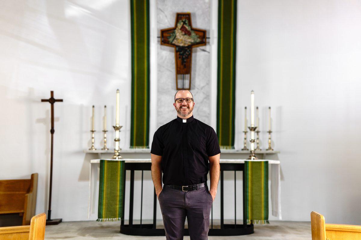 RJ Powell, chaplain at the Tyson House Episcopal-Lutheran Campus Ministry, stands in the Tyson House chapel on Aug. 30, 2022.