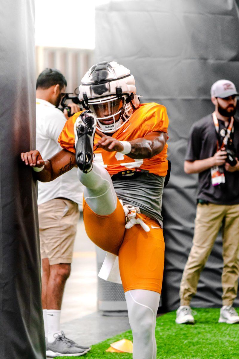 Defensive back Wesley Walker warms up before Tennessee's practice on Monday, Aug. 8, 2022. 