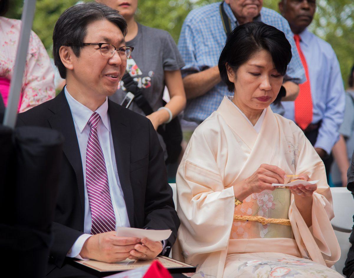 Consulate-General of Nashville Hiroyuki Kobayashi and the executive director of the Knoxville Asian Festival Kumi Alderman participate in a traditional Japanese tea ceremony at the Knoxville Asian Festival at World's Fair Park on August 25, 2019. 