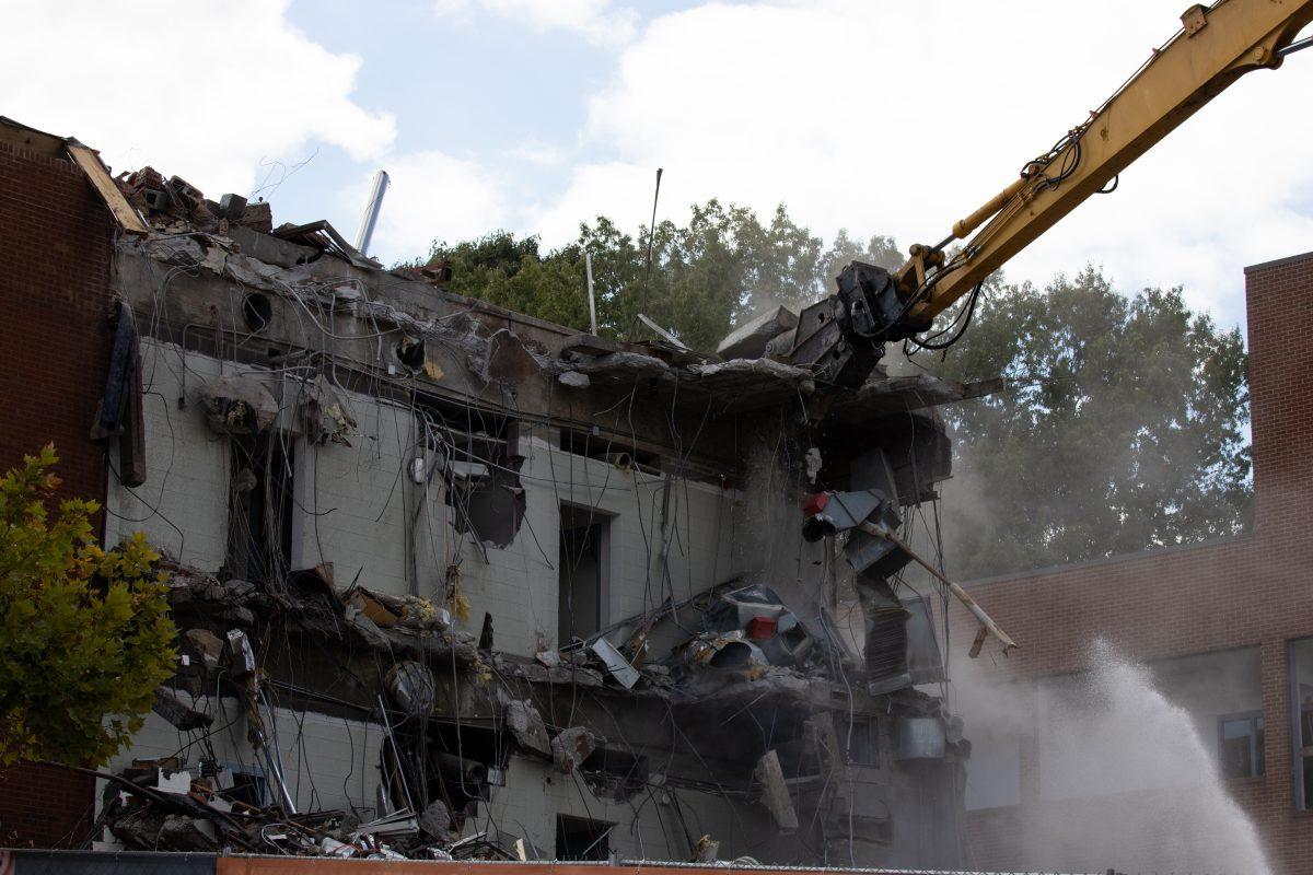 A demolition jaw tears into the College of Nursing building on Sept. 14, 2022, to make space for a new $85 million state-of-the-art facility. 