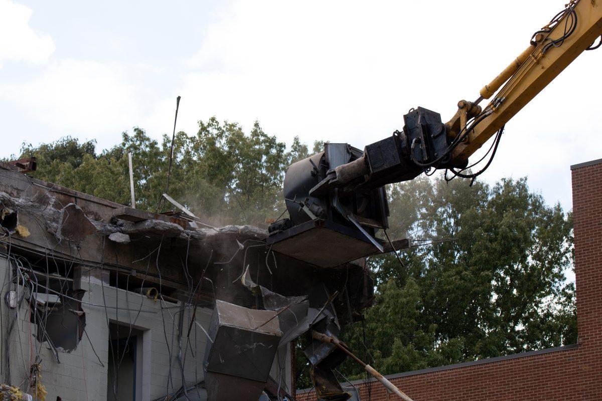 A demolition jaw tears into the College of Nursing building on Sept. 14, 2022, to make space for a new $85 million state-of-the-art facility. 