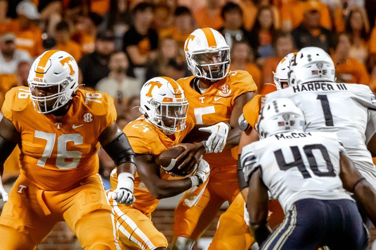 KNOXVILLE, TN - No. 5 quarterback Hendon Hooker hands off the ball at the start of a play during the non-conference game against Akron in Neyland Stadium. Saturday Sep. 17, 2022.