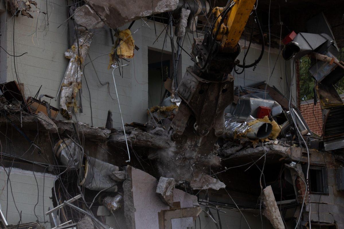 A demolition jaw tears into the College of Nursing building on Sept. 14, 2022, to make space for a new $85 million state-of-the-art facility expected to be completed in fall 2025. 