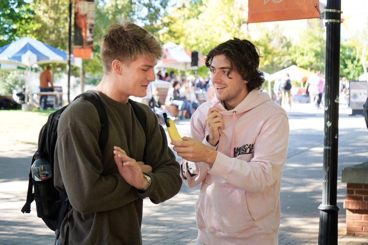 KNOXVILLE, TN - UT Senior Max Thompson interviews passing students for Tiktok on the UT Pedestrian Walkway. Friday, Sep. 30, 2022.