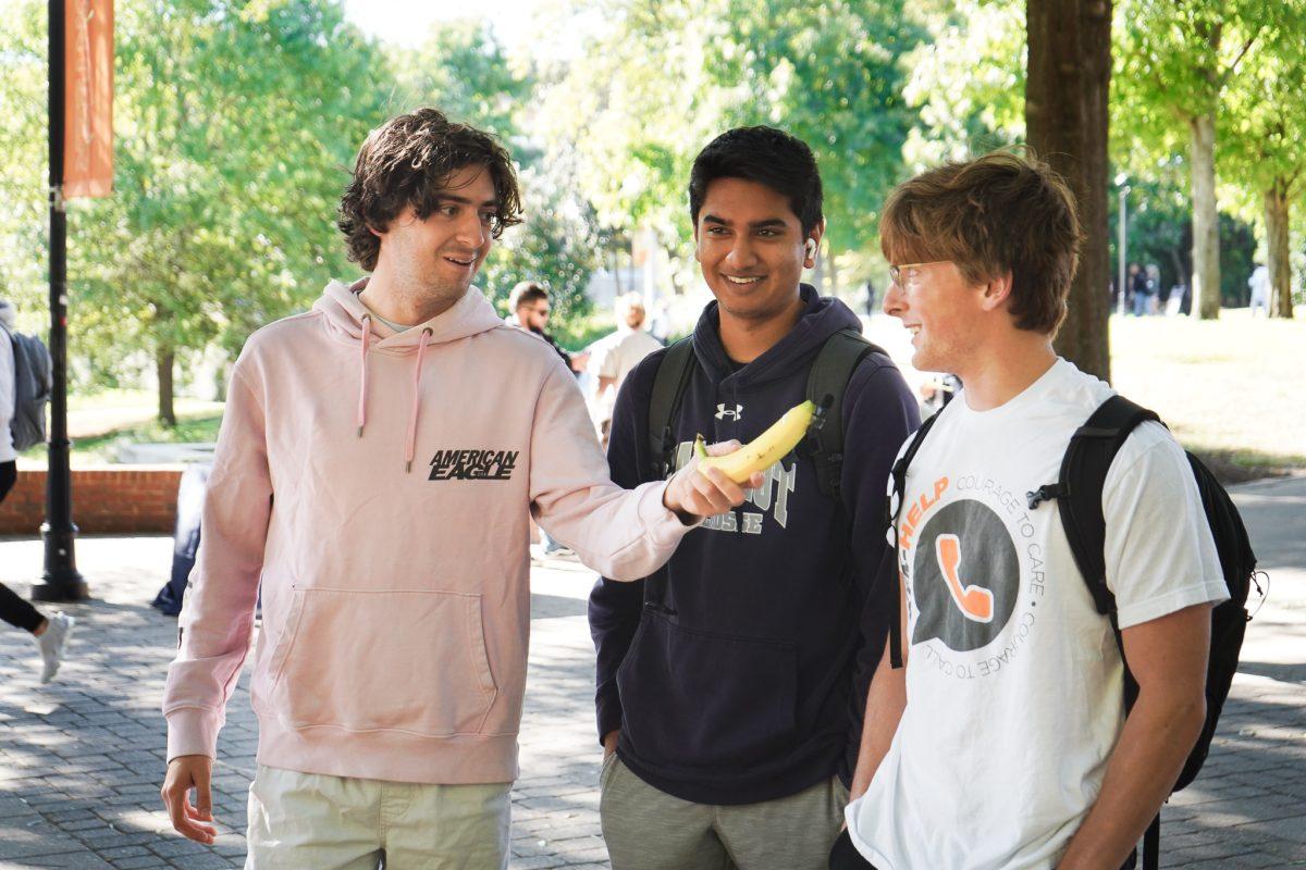 KNOXVILLE, TN - UT Senior Max Thompson interviews passing students for Tiktok on the UT Pedestrian Walkway. Friday, Sep. 30, 2022.