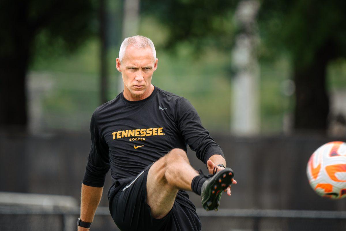 Lady Vol Soccer head coach Joe Kirt warms up with the team before the SMU match in Regal Stadium, Aug. 21, 2022.