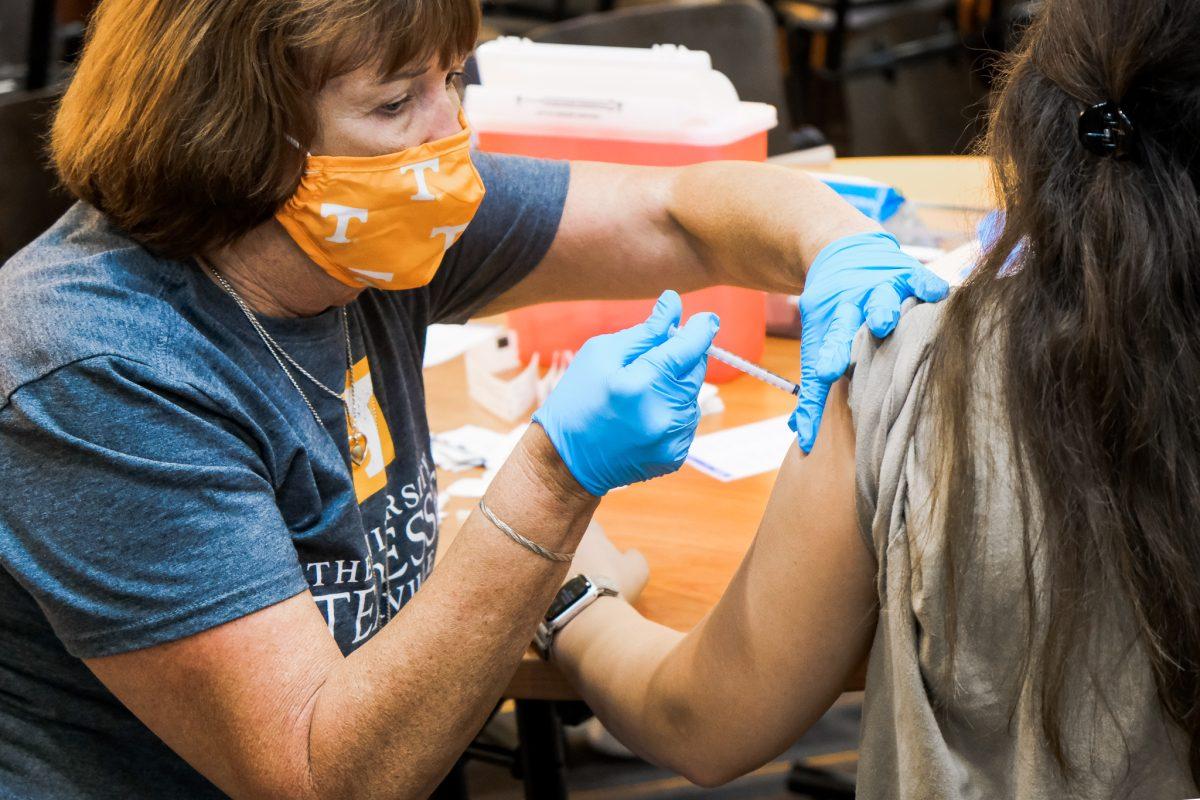 A UT student receives the COVID-19 vaccine during the Neyland Stadium free vaccination clinic on Aug. 19, 2021.