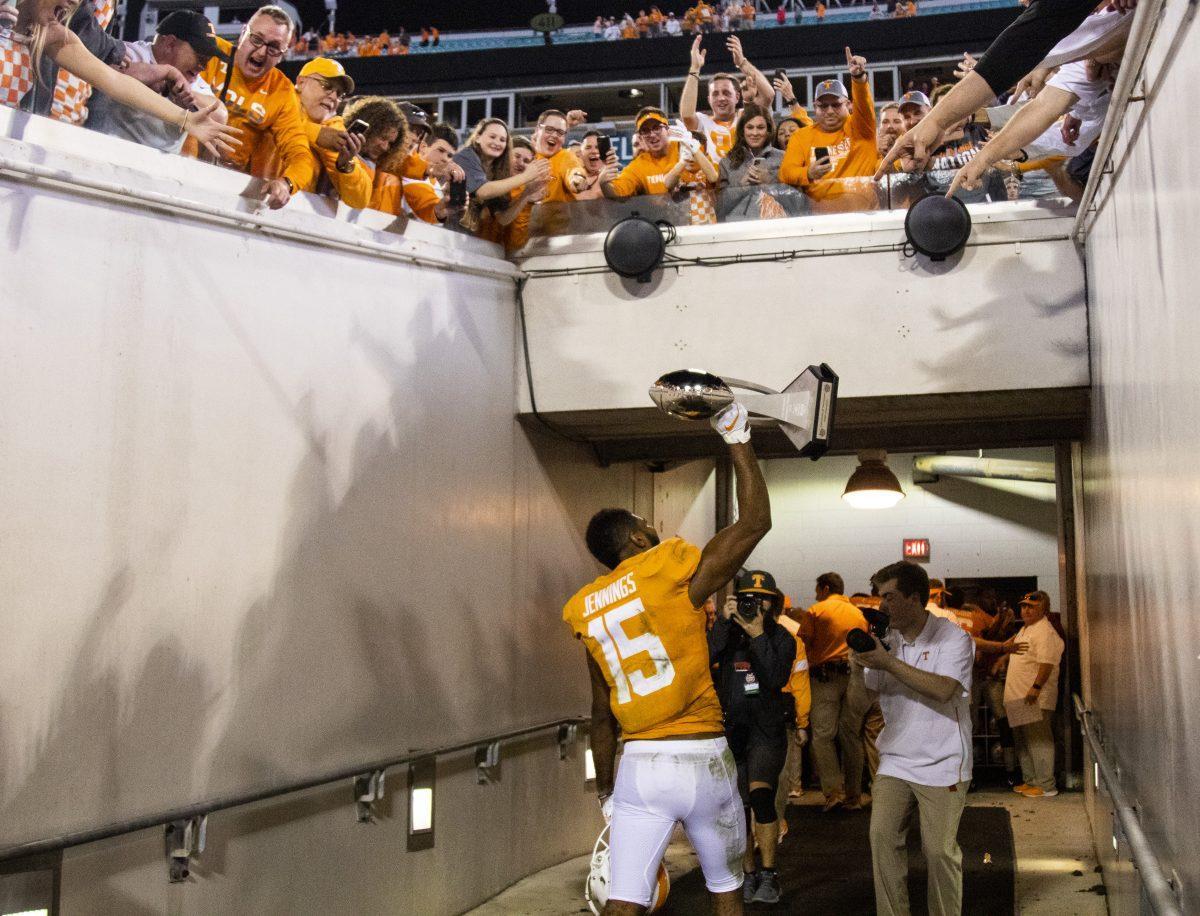 #15 Jauan Jennings showing off the trophy after the victory at the 2020 Tax Slayer Bowl game.