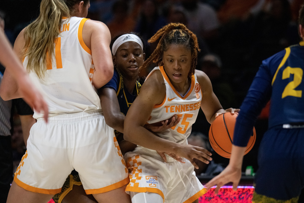 Jasmine Powell, No. 15, Drives through traffic in win over UTC on Tuesday, Dec. 6. 