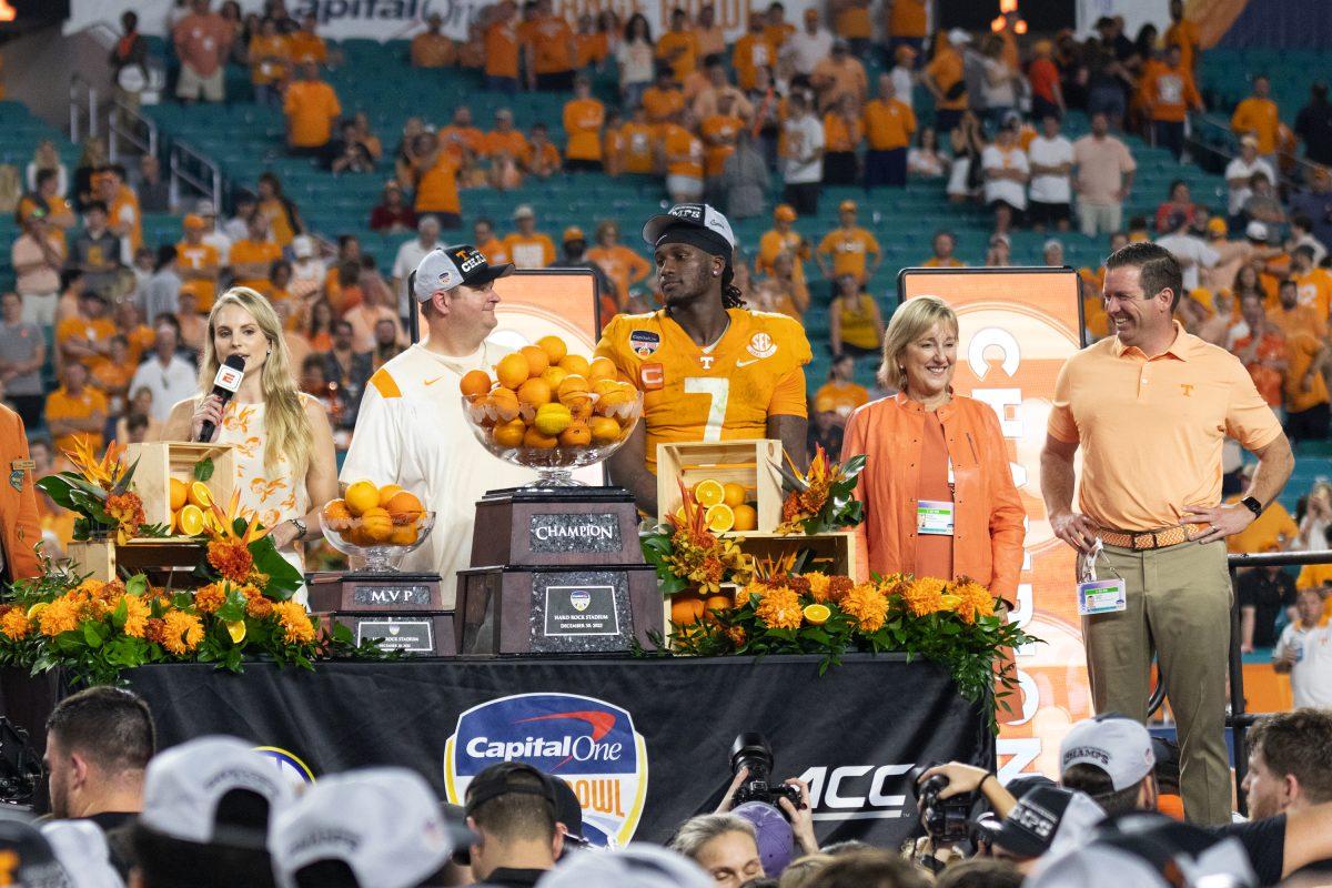 Tennessee coach Josh Heupel, Joe Milton III, Chancellor Donde Plowman and athletic director Danny White celebrate the Vols win against Clemson at the Orange Bowl in Miami's Hard Rock Stadium. Friday Dec. 30, 2022.