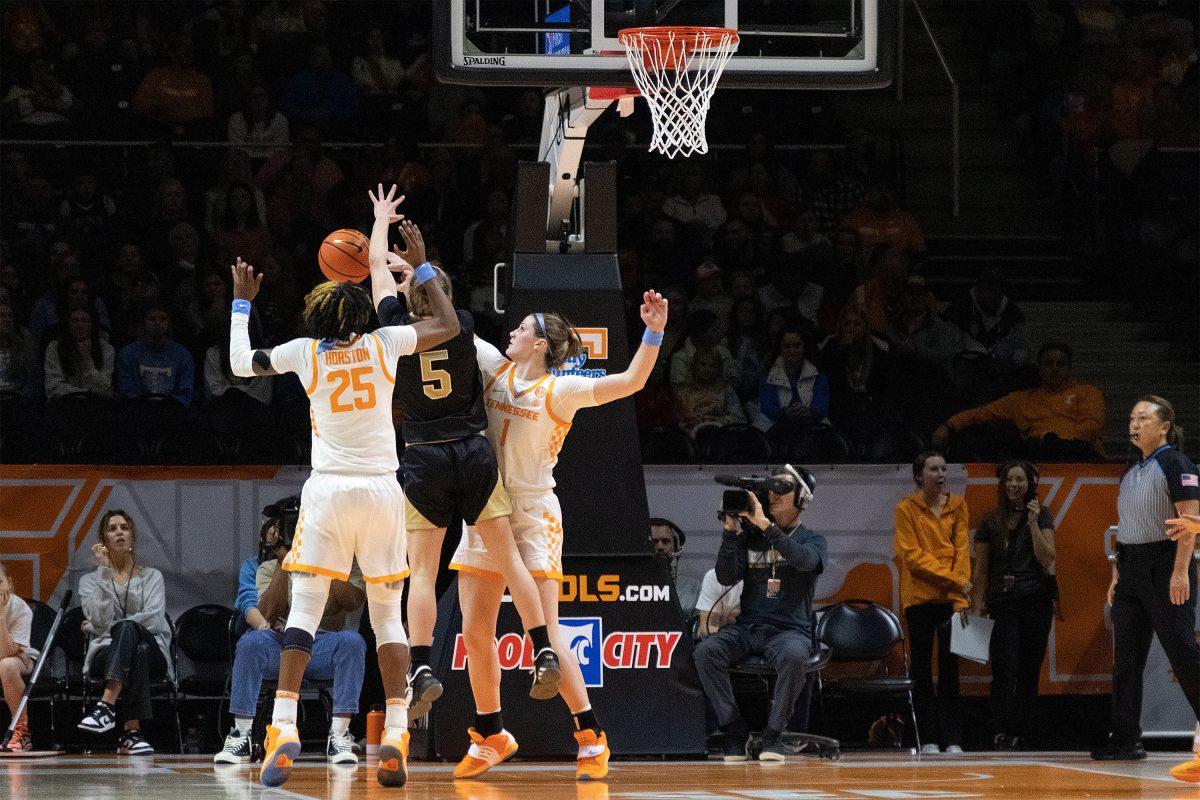 No. 1 Sara Puckett blocks a shot by Woffords No. 5 Helen Matthews at Thompson-Boling Arena. Tuesday Sept. 27, 2022.