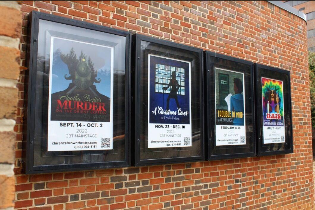 Framed posters of shows outside of Clarence Brown Theatre, Jan. 26, 2023.