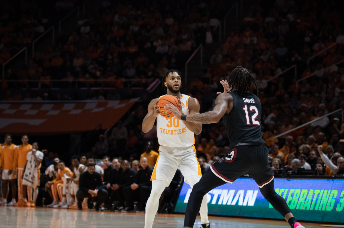 Josiah-Jordan James (30) looking to pass the ball during the Tennessee vs South Carolina game on Feb. 25, 2023 in Thompson-Boling Arena.
