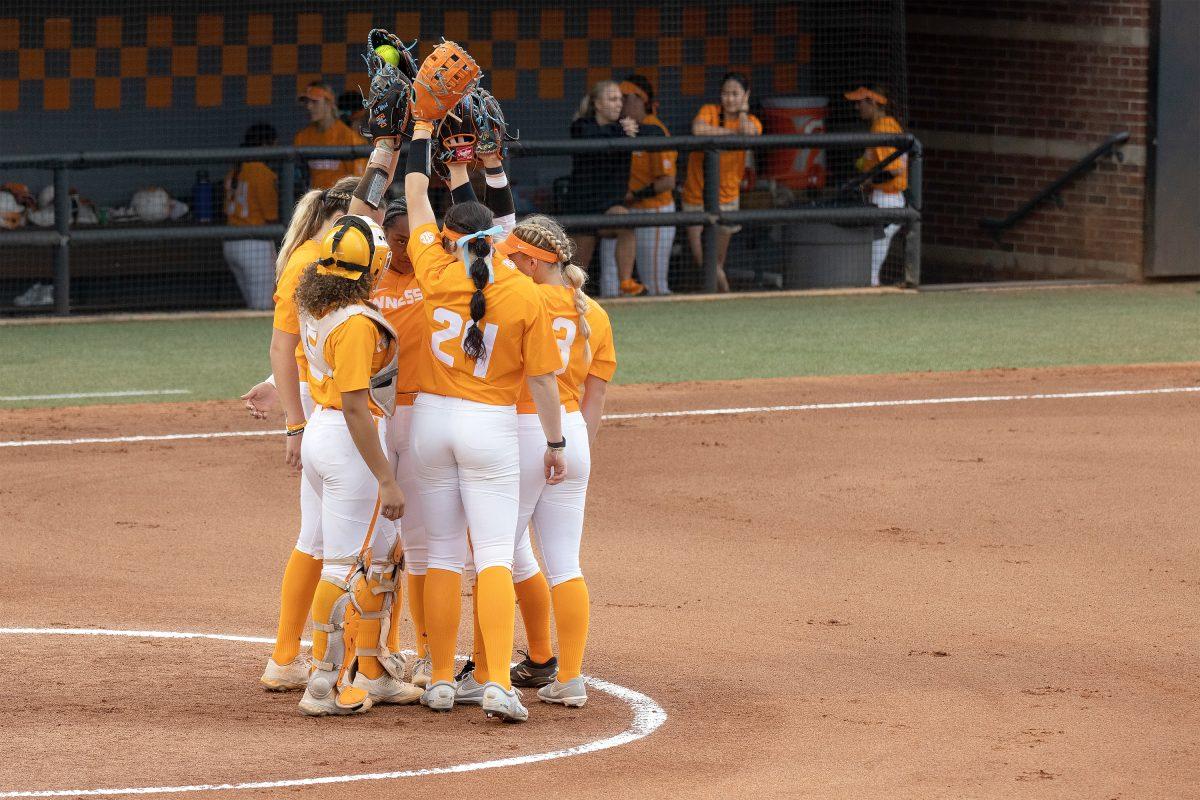 The Lady Vols infield players huddle together before the game against Pfeiffer University on Sept. 25, 2022.