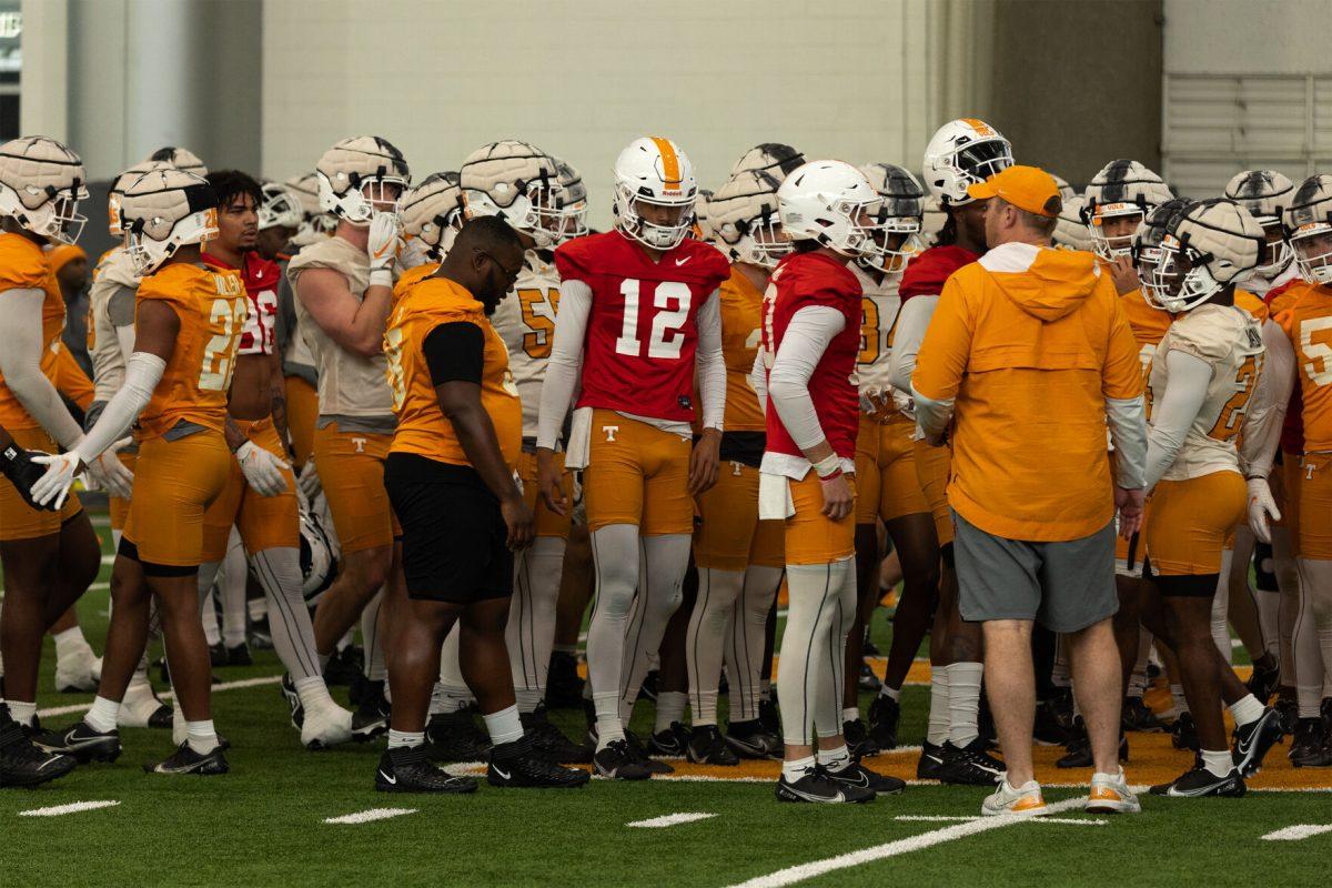 The Vols huddle up before the second day of spring practice on March 21, 2023.